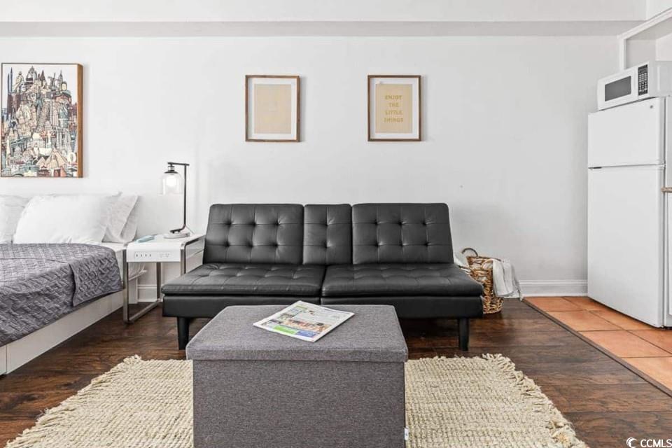 1207 South Ocean Boulevard, Unit 21001 Myrtle Beach, SC 29577 - Photo 7 of 23 Living room featuring dark wood-type flooring