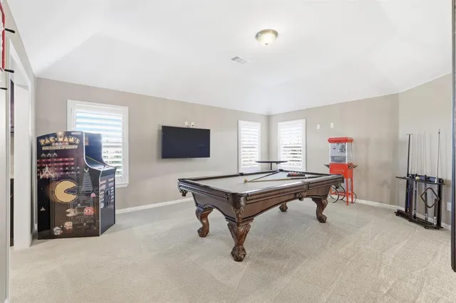 a bathroom with a bathtub sink and window