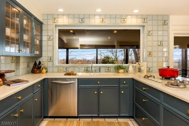 a kitchen with a sink and cabinets