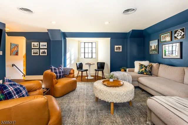 a view of a blue house with a yard