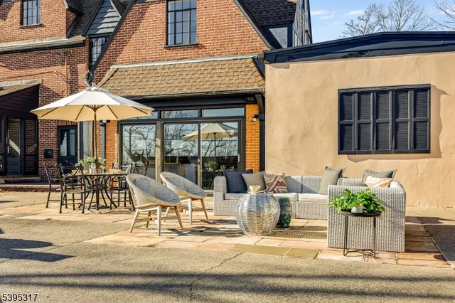 a patio with a table and chairs