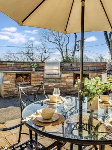 a view of a backyard with sitting area and furniture