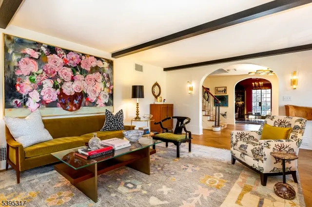 a living room with furniture and a rug