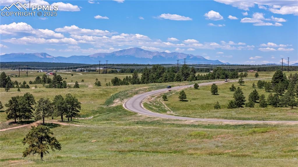 10906 Alamar Way Colorado Springs, CO 80908 - Photo 2 of 14 a view of a lake with a mountain