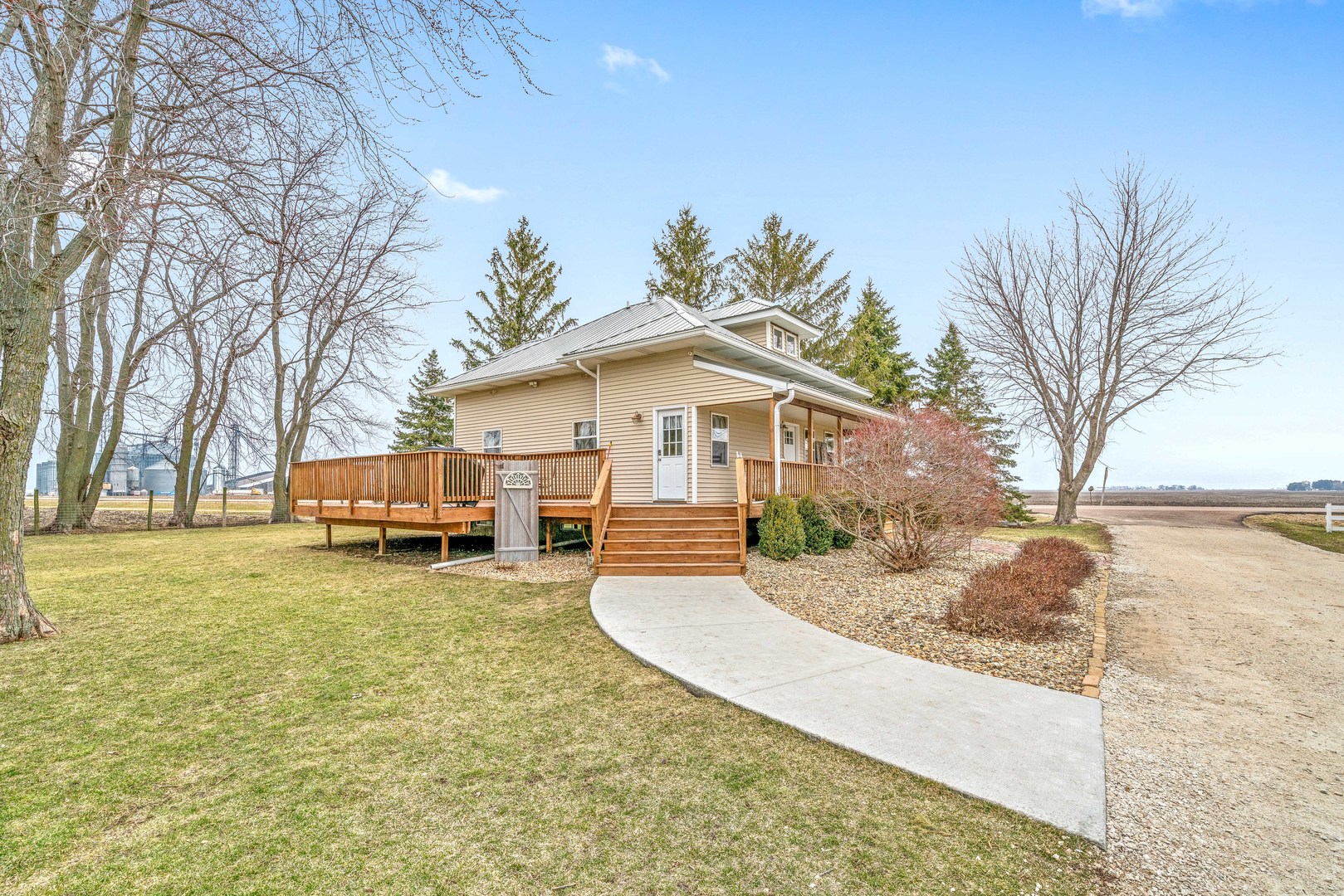 11036 Chicago Road Waterman, IL 60556 - Photo 2 of 43 a view of a house with backyard and trees