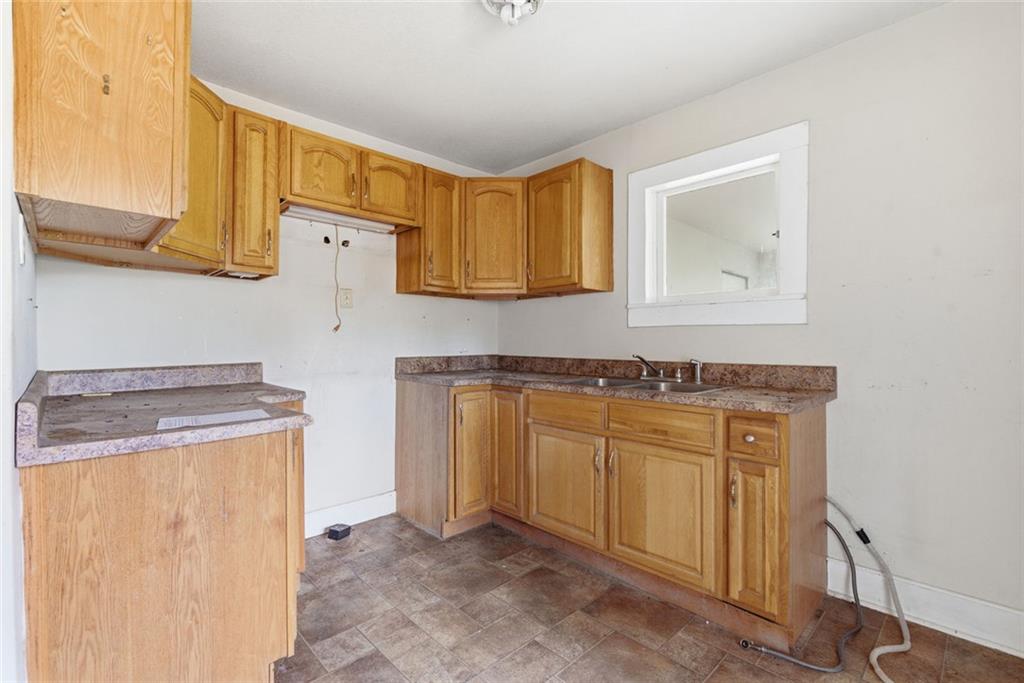 1805 Blue Ridge Drive Blue Ridge, GA 30513 - Photo 13 of 31 a kitchen with stainless steel appliances granite countertop a sink and cabinets with wooden floor