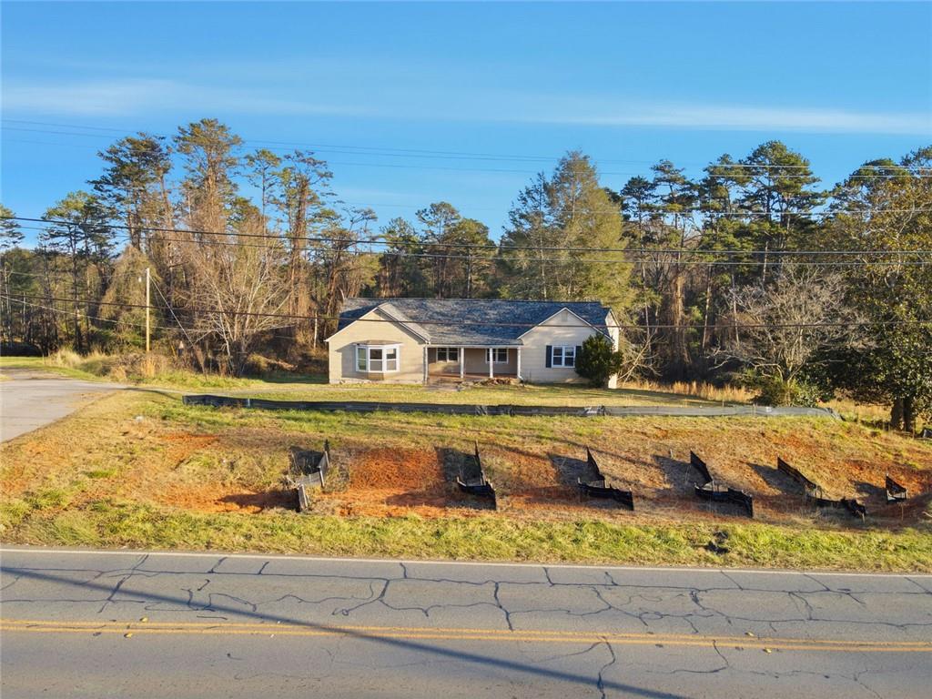 1805 Blue Ridge Drive Blue Ridge, GA 30513 - Photo 28 of 31 a view of a swimming pool with a yard and large tree
