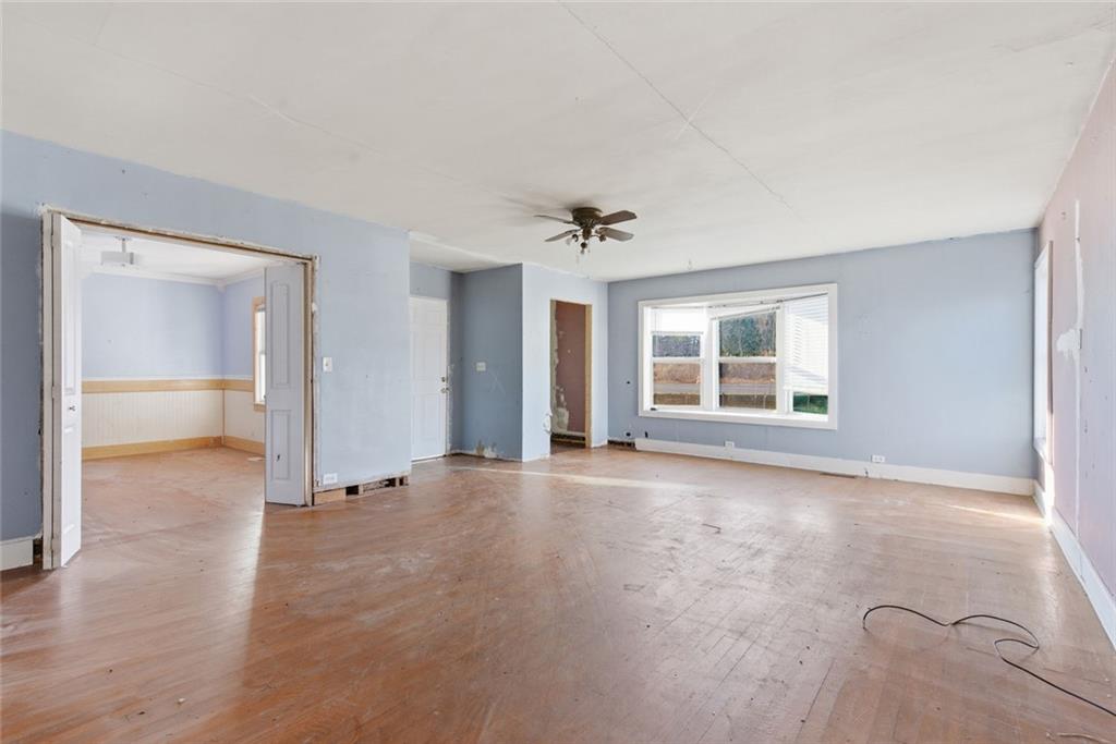 1805 Blue Ridge Drive Blue Ridge, GA 30513 - Photo 9 of 31 wooden floor in an empty room with a window