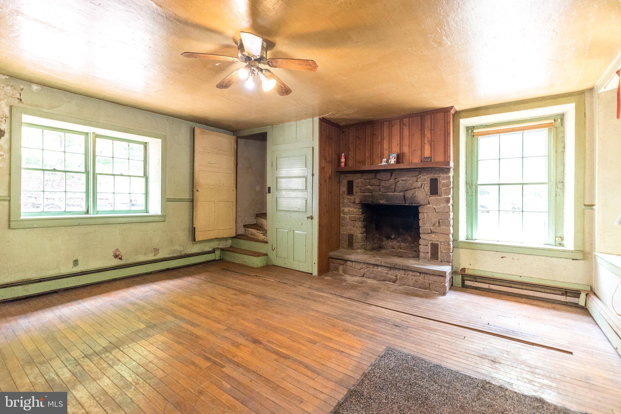 118 Geigel Hill Road Erwinna, PA 18920 - Photo 13 of 30 a view of an empty room with a fireplace and a window
