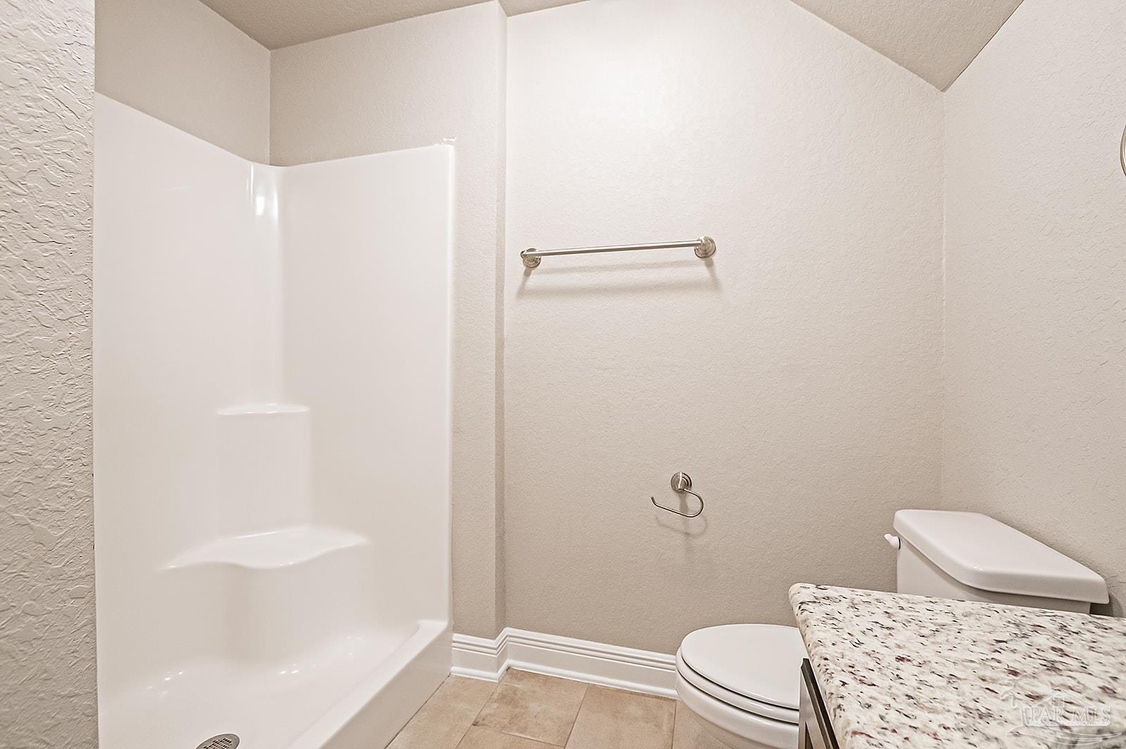 5398 Parkside Drive Pace, FL 32571 - Photo 19 of 36 a bathroom with a toilet and shower
