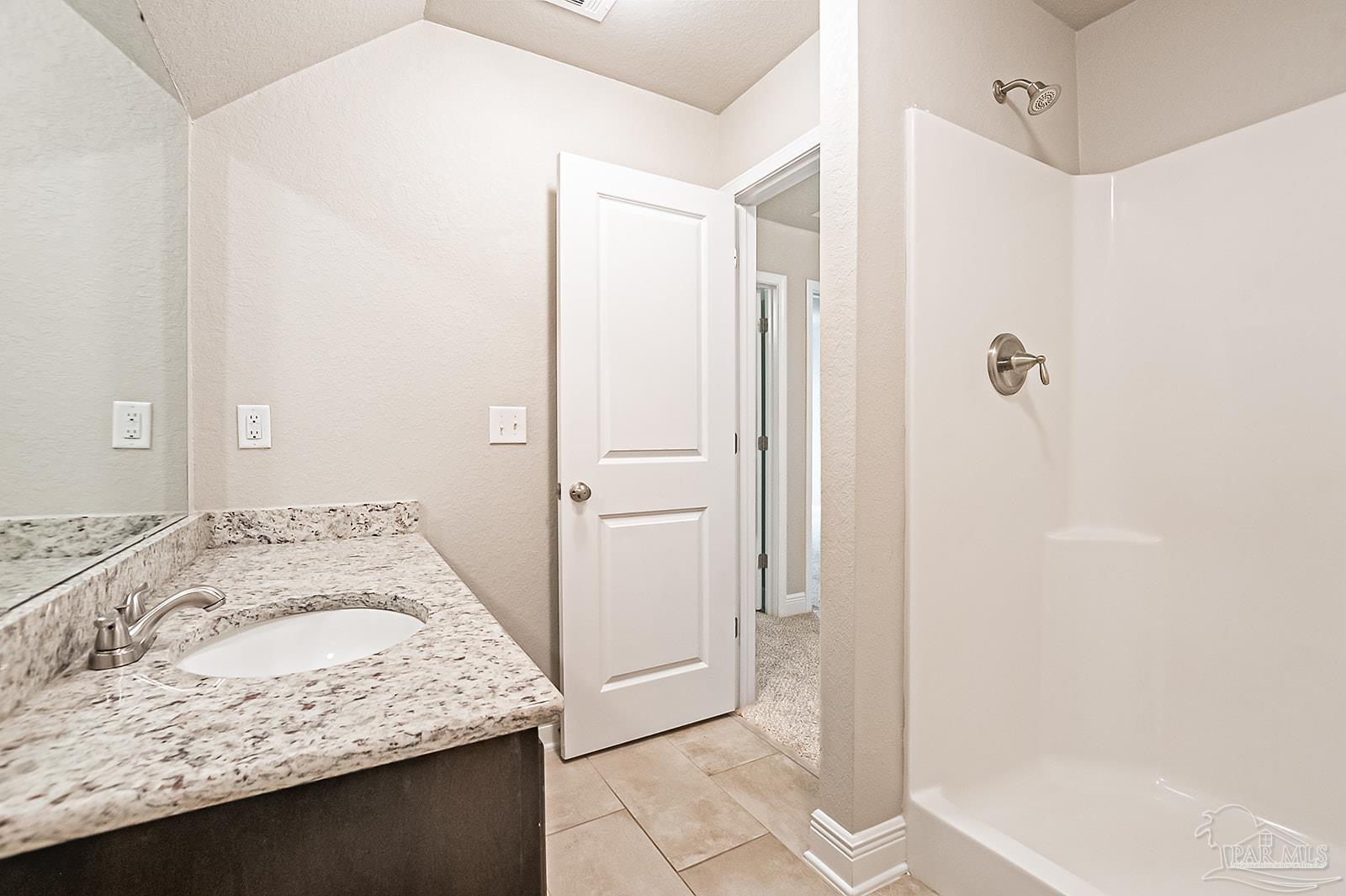 5398 Parkside Drive Pace, FL 32571 - Photo 20 of 36 a bathroom with a granite countertop sink and a mirror