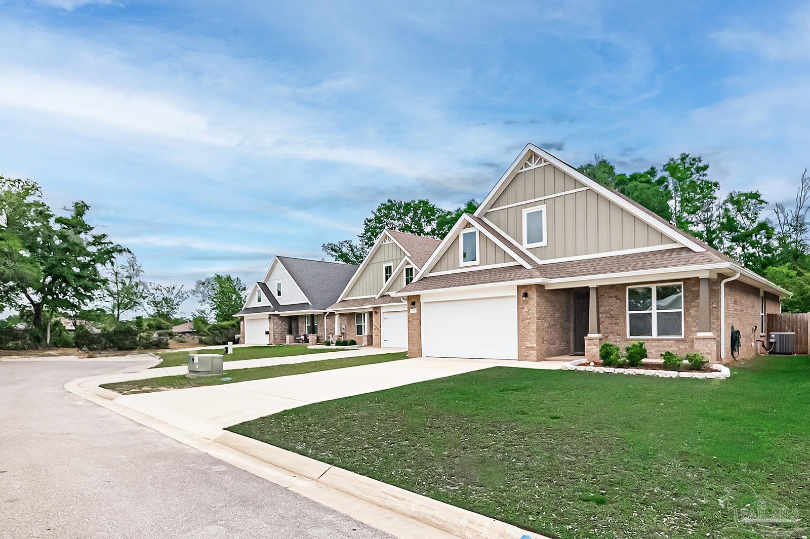 5398 Parkside Drive Pace, FL 32571 - Photo 3 of 36 a front view of a house with a yard