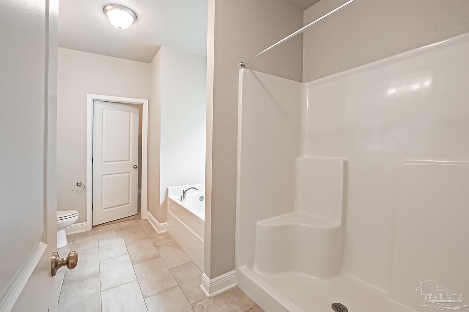 5398 Parkside Drive Pace, FL 32571 - Photo 33 of 36 a bathroom with a tub and shower