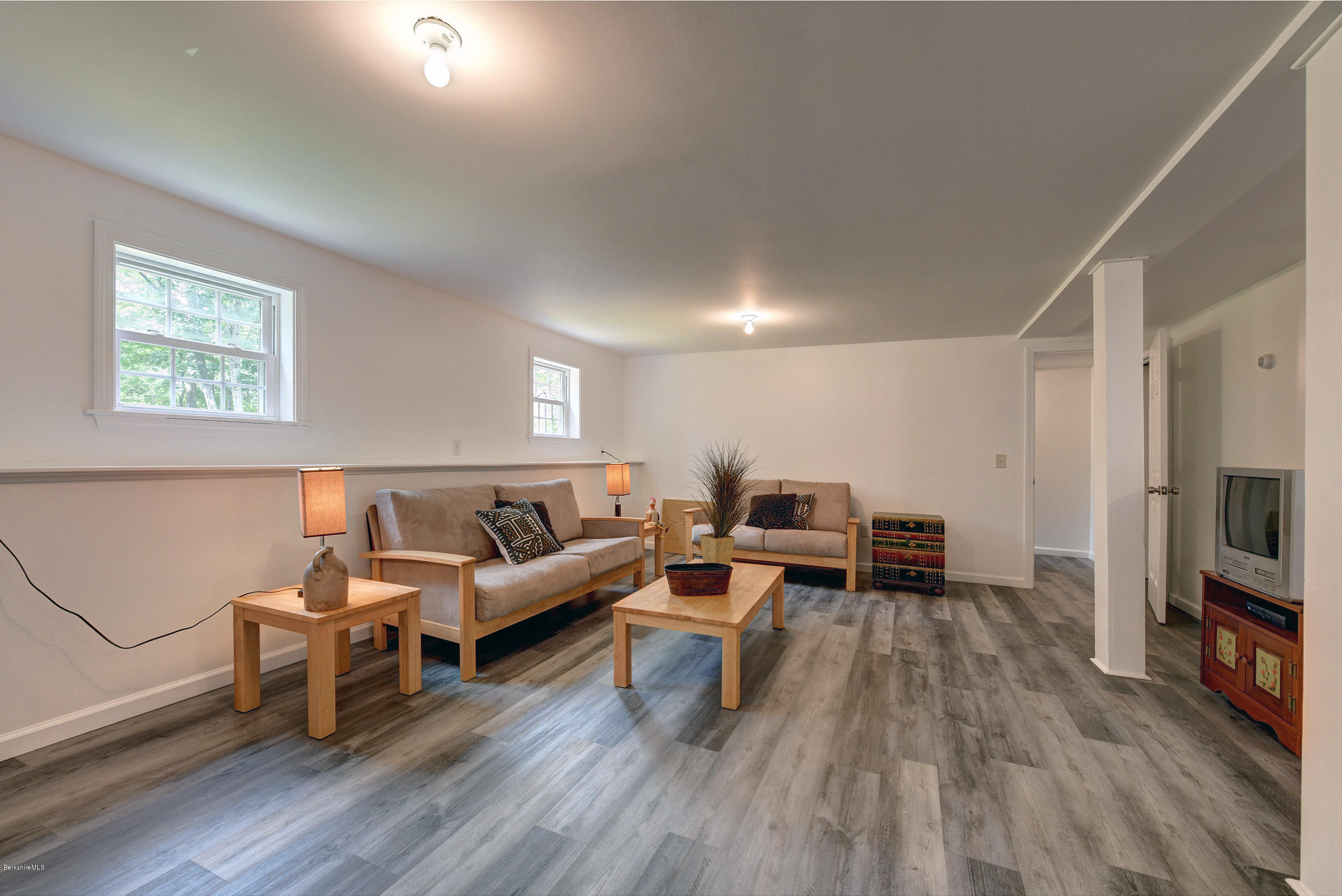 15 Lake View Road Peru, MA 01235 - Photo 23 of 39 a living room with furniture flat screen tv and wooden floor