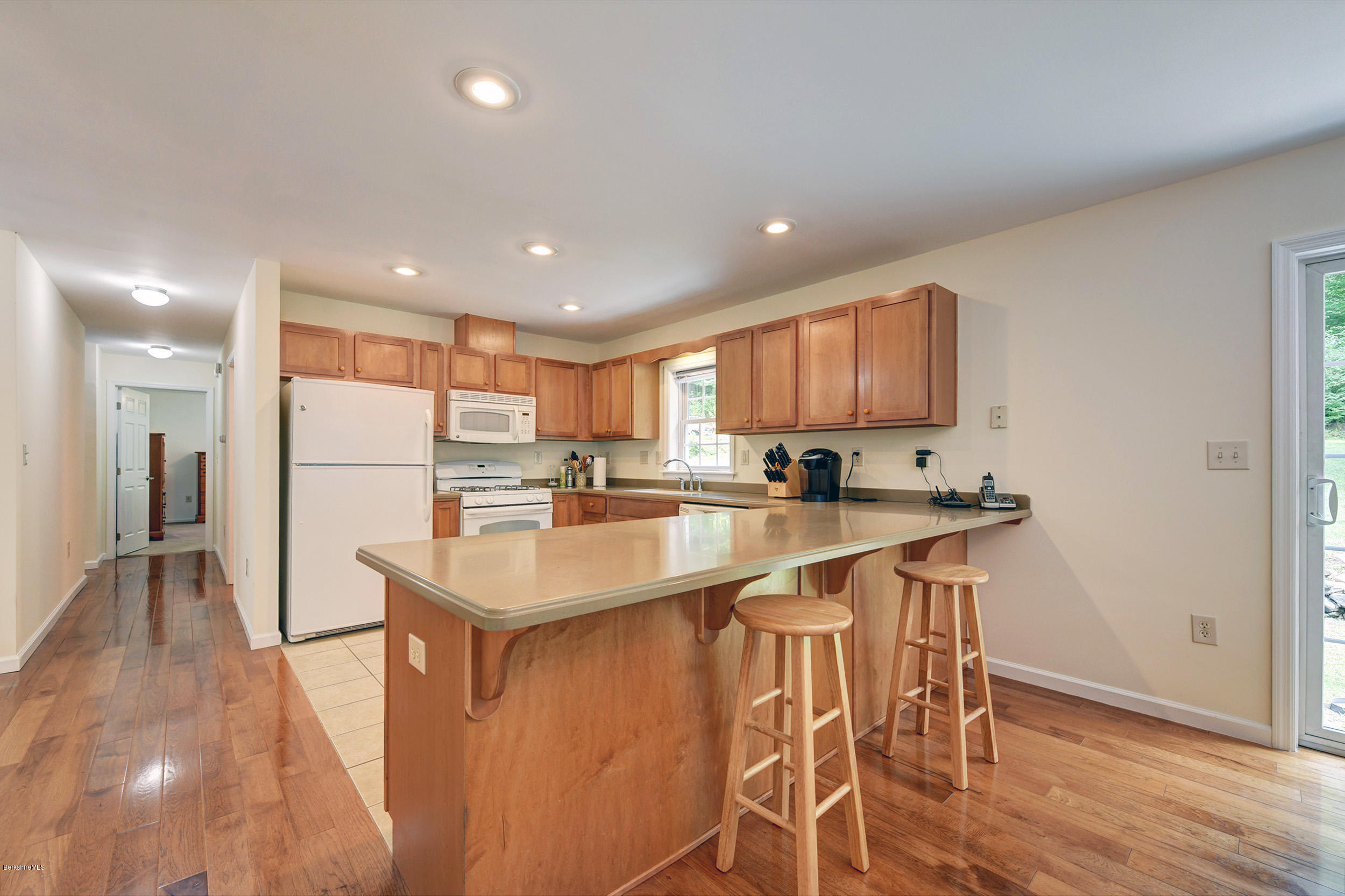 15 Lake View Road Peru, MA 01235 - Photo 10 of 39 a kitchen with stainless steel appliances granite countertop a refrigerator a sink dishwasher a stove and a refrigerator with wooden floor