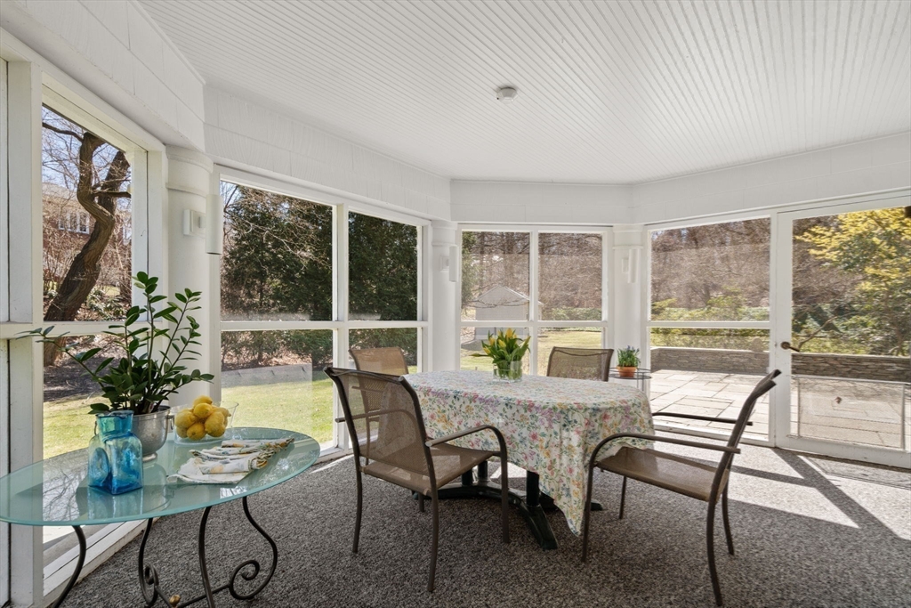 530 Clinton Road Brookline, MA 02467 - Photo 12 of 25 a view of a dining room with furniture window and outside view