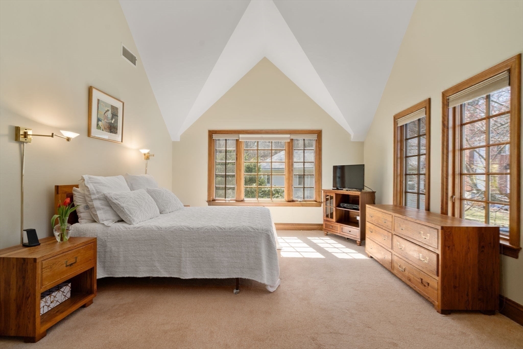 530 Clinton Road Brookline, MA 02467 - Photo 14 of 25 a bedroom with a bed and a large window