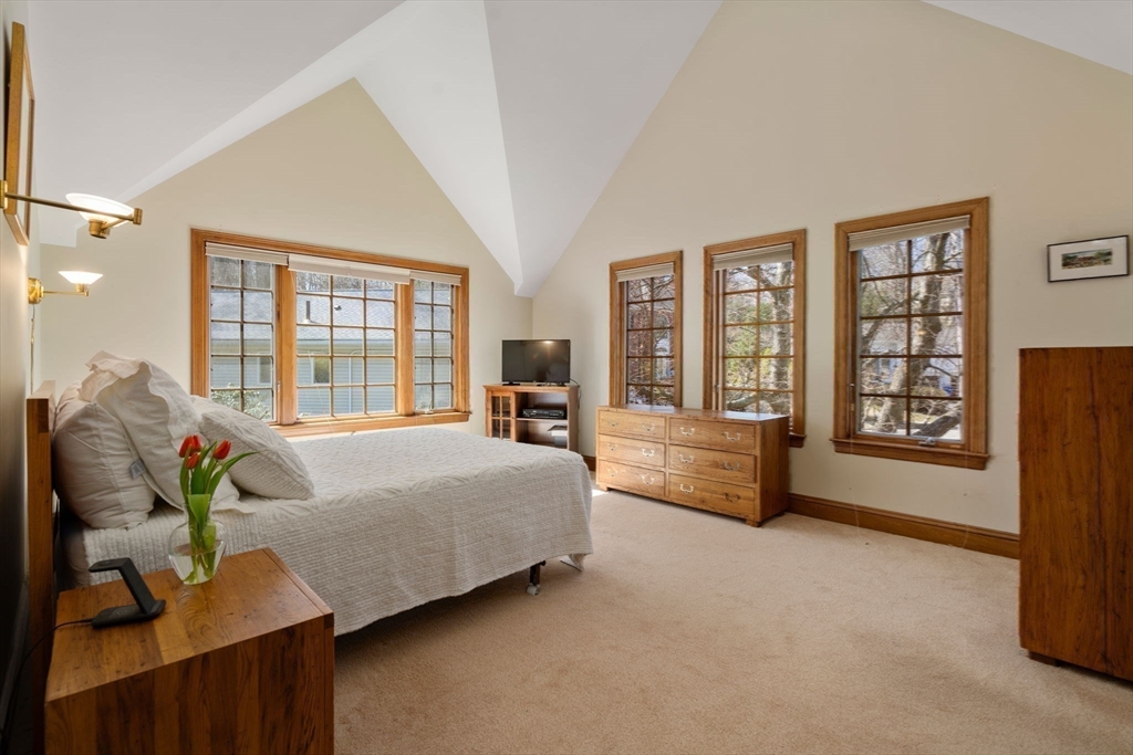 530 Clinton Road Brookline, MA 02467 - Photo 15 of 25 a spacious bedroom with a bed and large windows