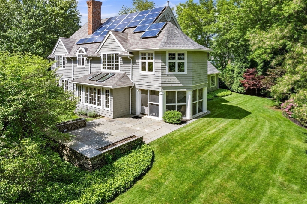 530 Clinton Road Brookline, MA 02467 - Photo 18 of 25 a front view of a house with a garden
