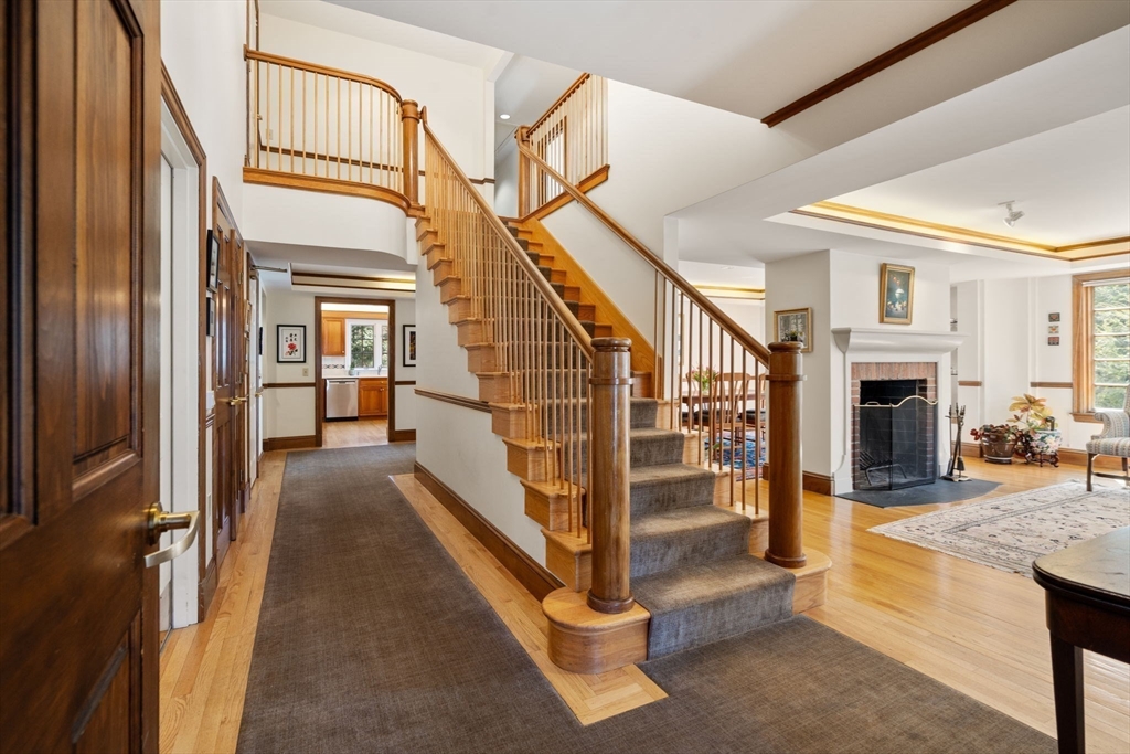 530 Clinton Road Brookline, MA 02467 - Photo 2 of 25 a view of entryway and hall with wooden floor