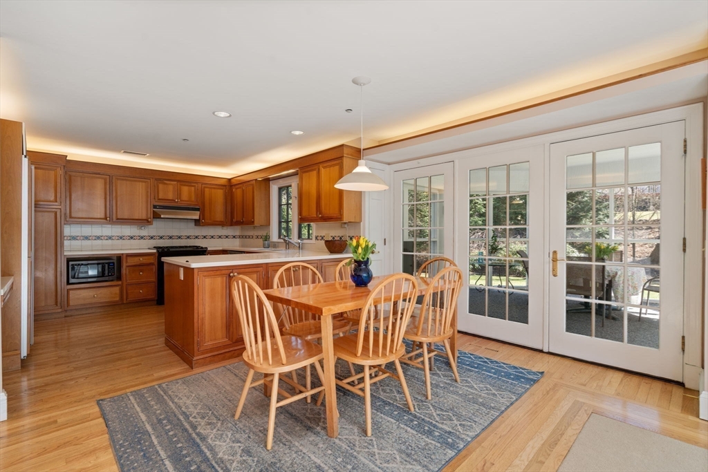530 Clinton Road Brookline, MA 02467 - Photo 10 of 25 a dining room with furniture and wooden floor