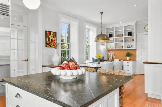 a view of kitchen island with furniture and wooden floor
