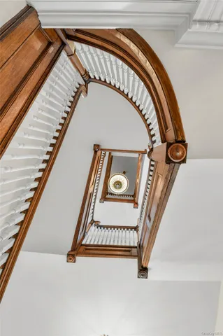 a bedroom with a bed window and table