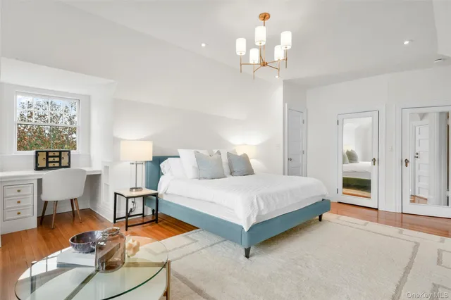 a bedroom with a bed and a view of en suite bathroom