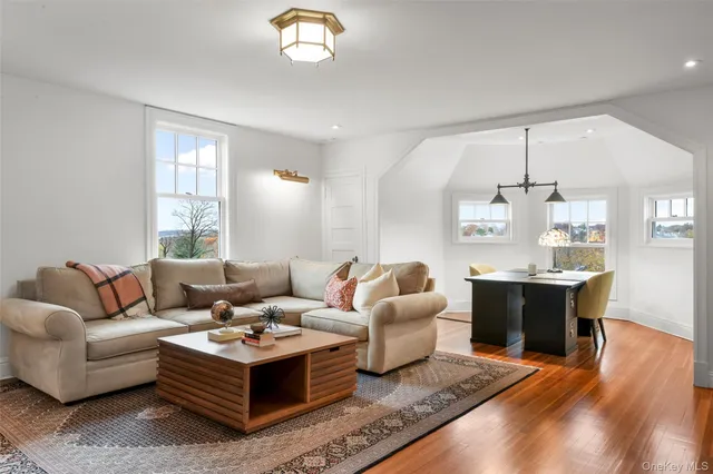 a view of a workspace with furniture