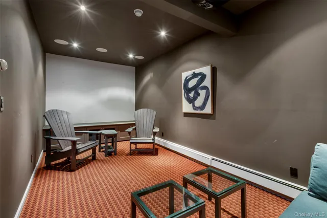 a bathroom with a sink mirror and toilet