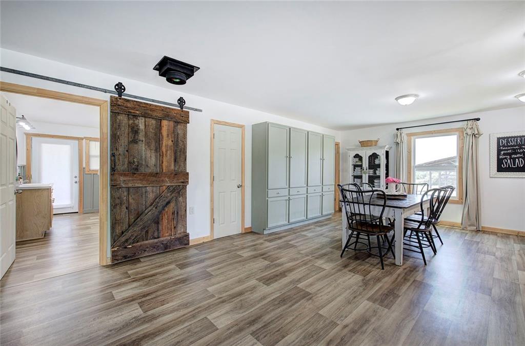 765 Addison Road Buchanan, GA 30113 - Photo 10 of 50 a dining room with furniture and wooden floor