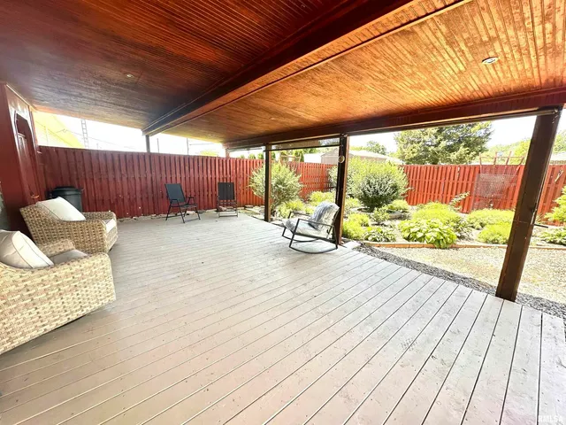 a view of a chairs in wooden deck