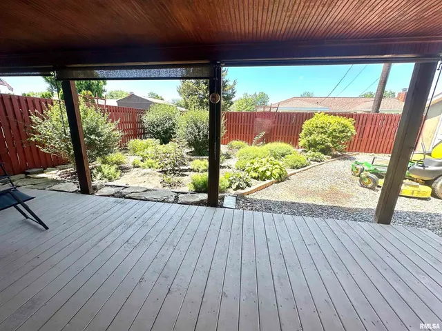 a view of porch with wooden floor