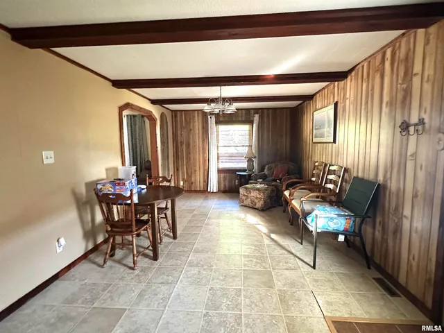 a lobby with furniture and a potted plant