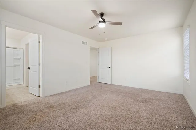 a bathroom with a shower sink vanity granite and shower