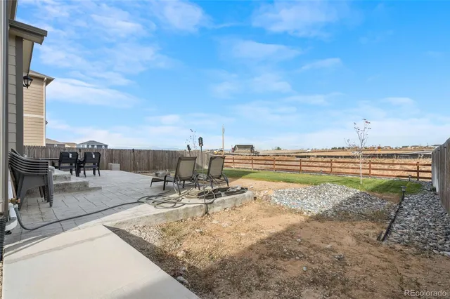 a view of a terrace with wooden floor and seating space