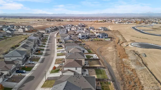 an aerial view of a city with ocean view