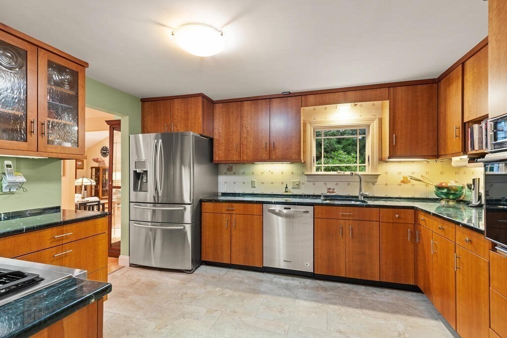 82 Cary Avenue Lexington, MA 02421 - Photo 11 of 29 a kitchen with stainless steel appliances granite countertop a refrigerator a sink dishwasher a stove top oven and a refrigerator