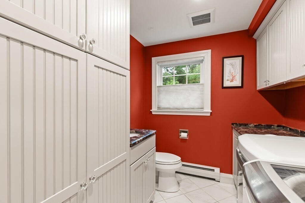 82 Cary Avenue Lexington, MA 02421 - Photo 12 of 29 a bathroom with a toilet a sink and a window