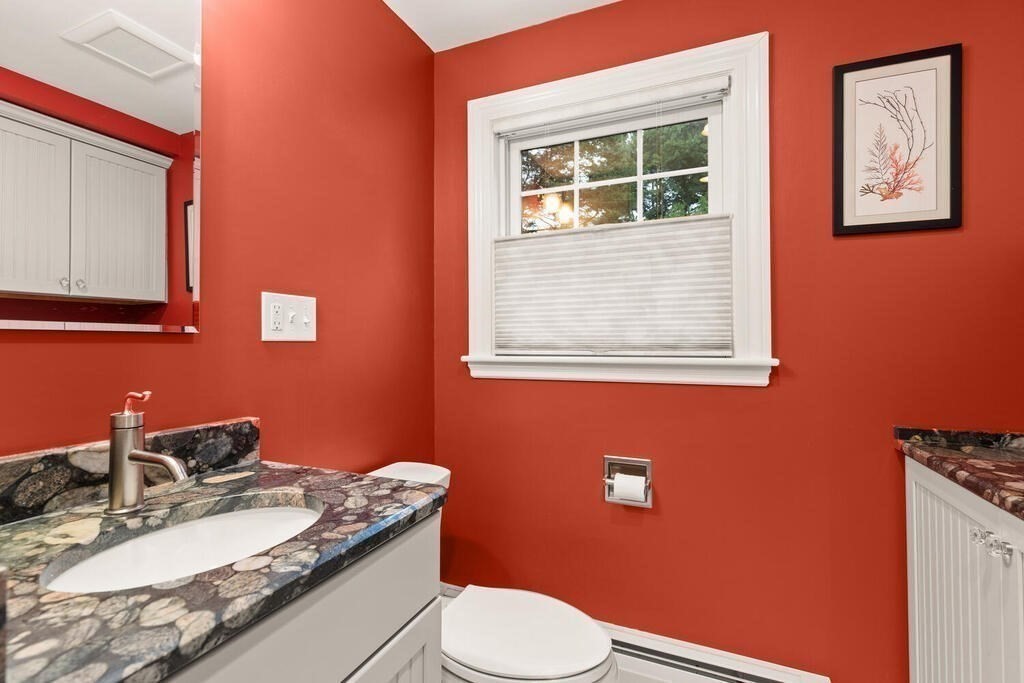 82 Cary Avenue Lexington, MA 02421 - Photo 13 of 29 a bathroom with a granite countertop toilet sink and mirror