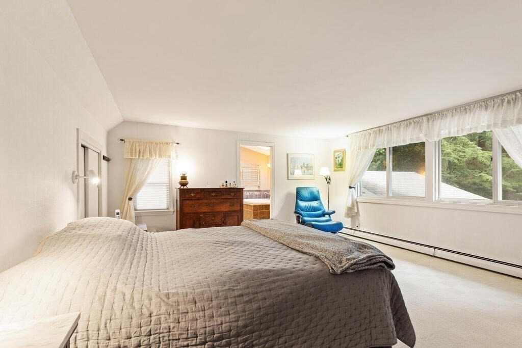 82 Cary Avenue Lexington, MA 02421 - Photo 19 of 29 a bedroom with a large bed and a large window