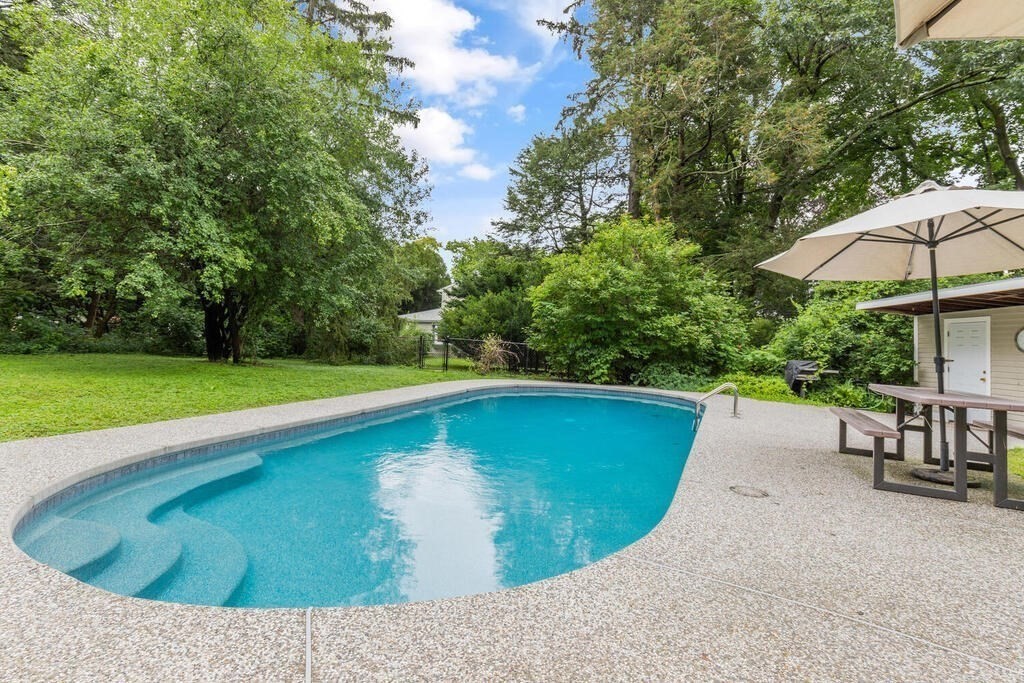 82 Cary Avenue Lexington, MA 02421 - Photo 2 of 29 a view of a swimming pool with a yard and sitting area
