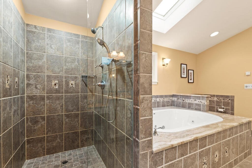 82 Cary Avenue Lexington, MA 02421 - Photo 22 of 29 a bathroom with a bathtub and shower