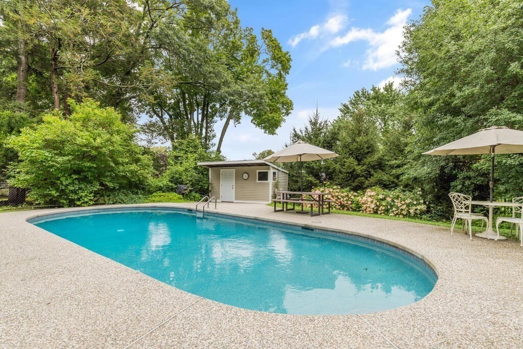 82 Cary Avenue Lexington, MA 02421 - Photo 29 of 29 a view of a swimming pool with a patio