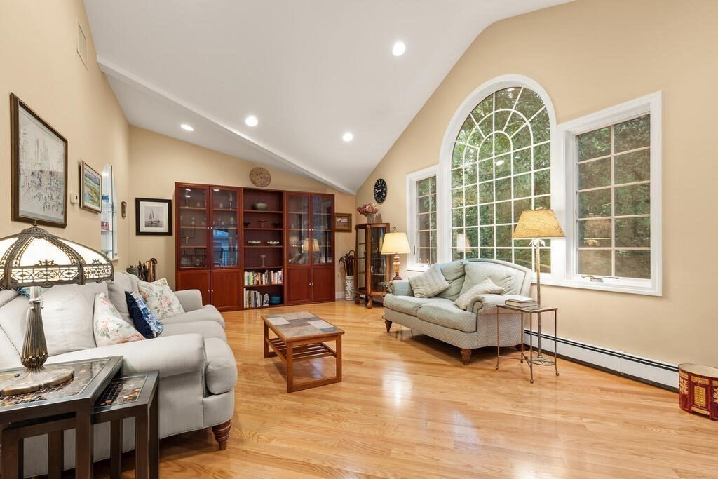 82 Cary Avenue Lexington, MA 02421 - Photo 3 of 29 a living room with furniture and a large window