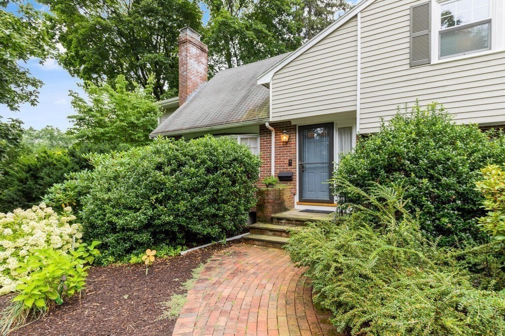 82 Cary Avenue Lexington, MA 02421 - Photo 4 of 29 a view of a house with potted plants and more windows