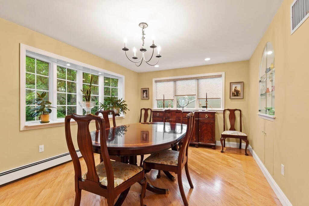 82 Cary Avenue Lexington, MA 02421 - Photo 7 of 29 a view of a dining room with furniture window and wooden floor