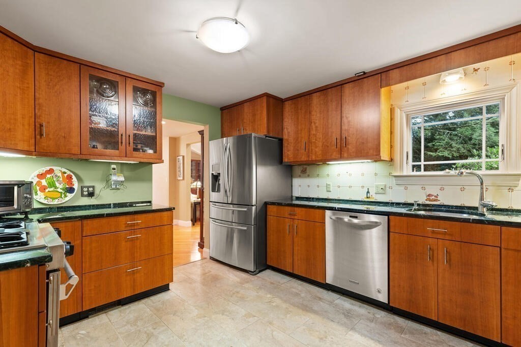 82 Cary Avenue Lexington, MA 02421 - Photo 10 of 29 a kitchen with stainless steel appliances granite countertop a refrigerator sink and cabinets