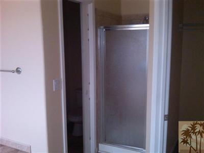 59498 Everett Road Anza, CA 92539 - Photo 12 of 22 a bathroom with a glass shower door
