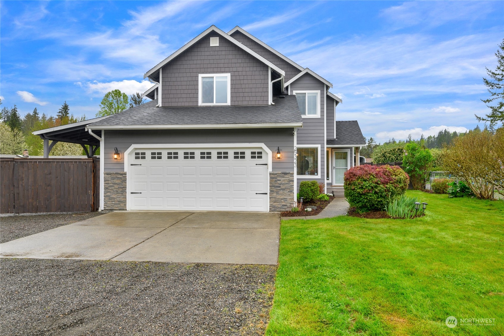 25323 Cromwell Road Monroe, WA 98272 - Photo 1 of 38 a front view of a house with a yard and garage